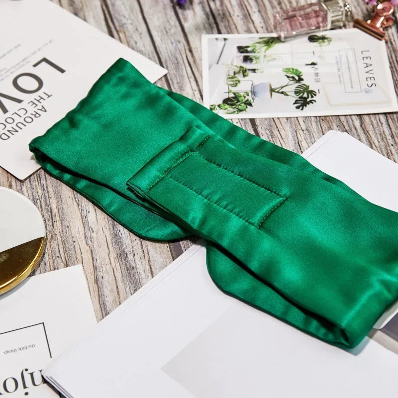 Mulberry silk sleep eye mask shown in multiple colours: black, gold, blue, grey, white, pink, and green.