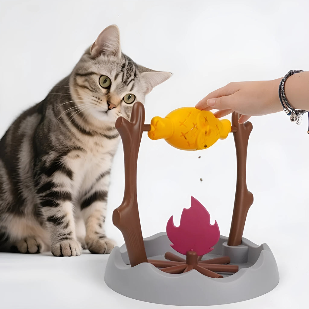 Large barbecue-themed tumbling cat feeder toy for slow feeding and play.