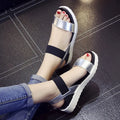 Women's elastic wedge sandals in black with low heel and round toe