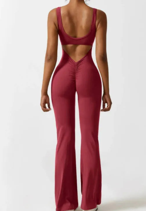 Black women's tight seamless yoga bodysuit with a mid waist and trousers length.