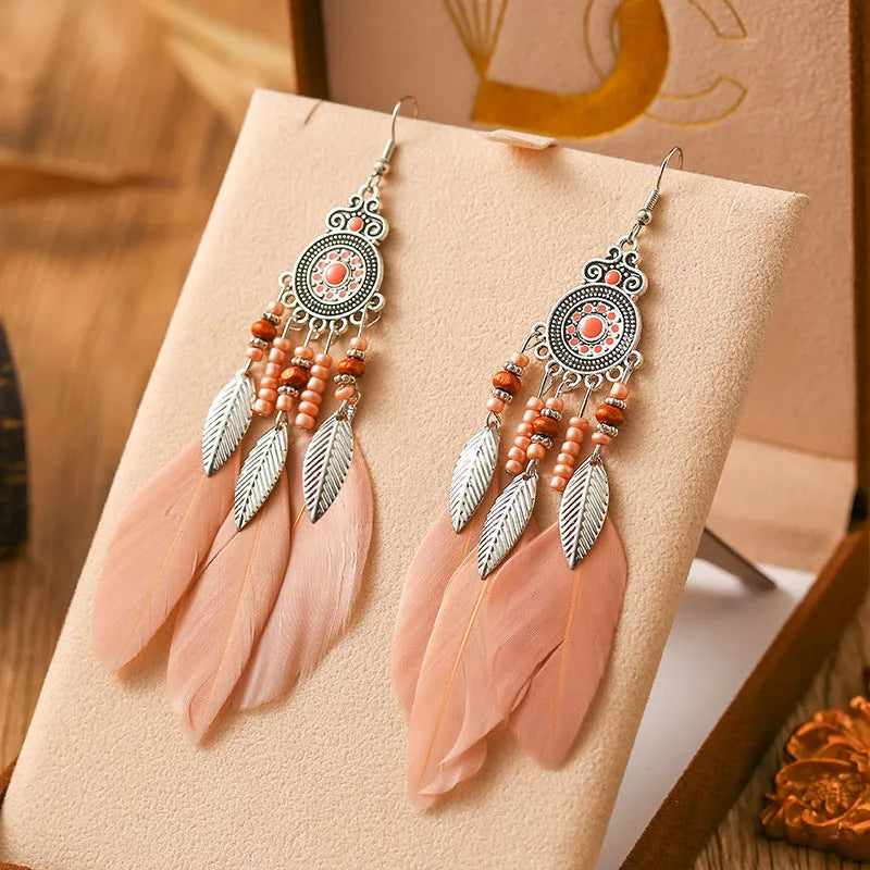 Round drop feather design alloy earrings with leaf pattern in a bohemian style, showing electroplated finish.