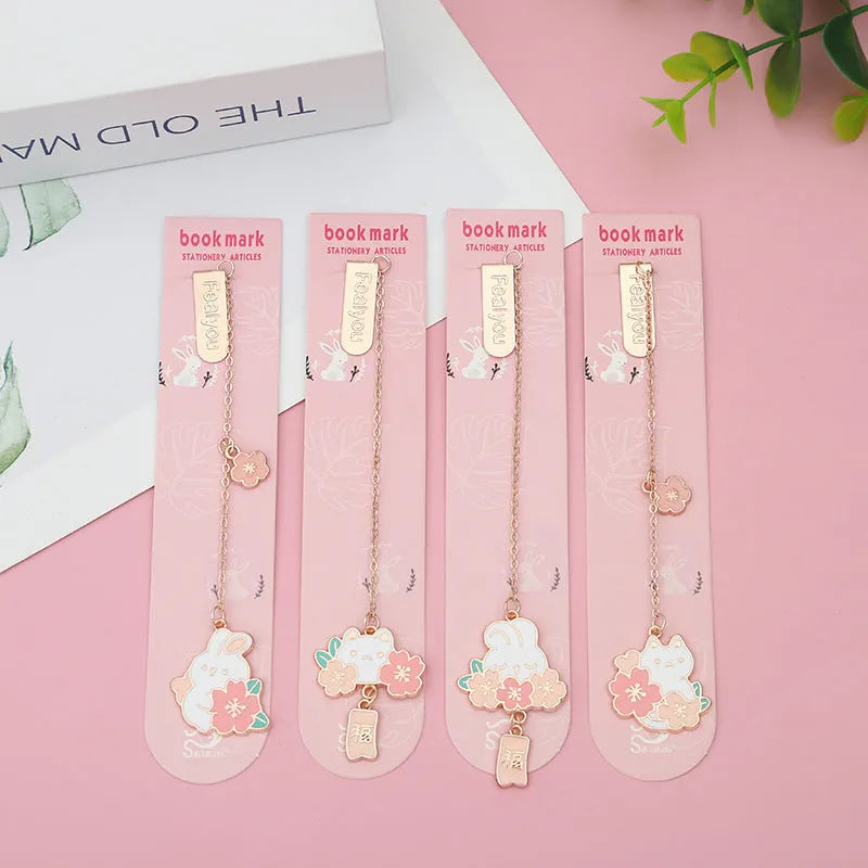 Creative cartoon metal pendant bookmark holder with cherry cat design.
