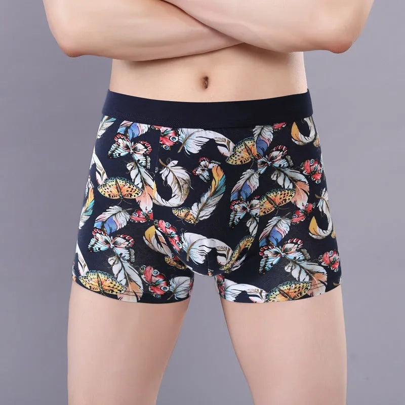 Men's floral print cotton boxer shorts showing mid-waist fit and U-shaped convex design.