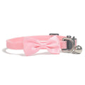 Adjustable striped nylon cat collar with a small bell, shown in multiple colour options on a white background.