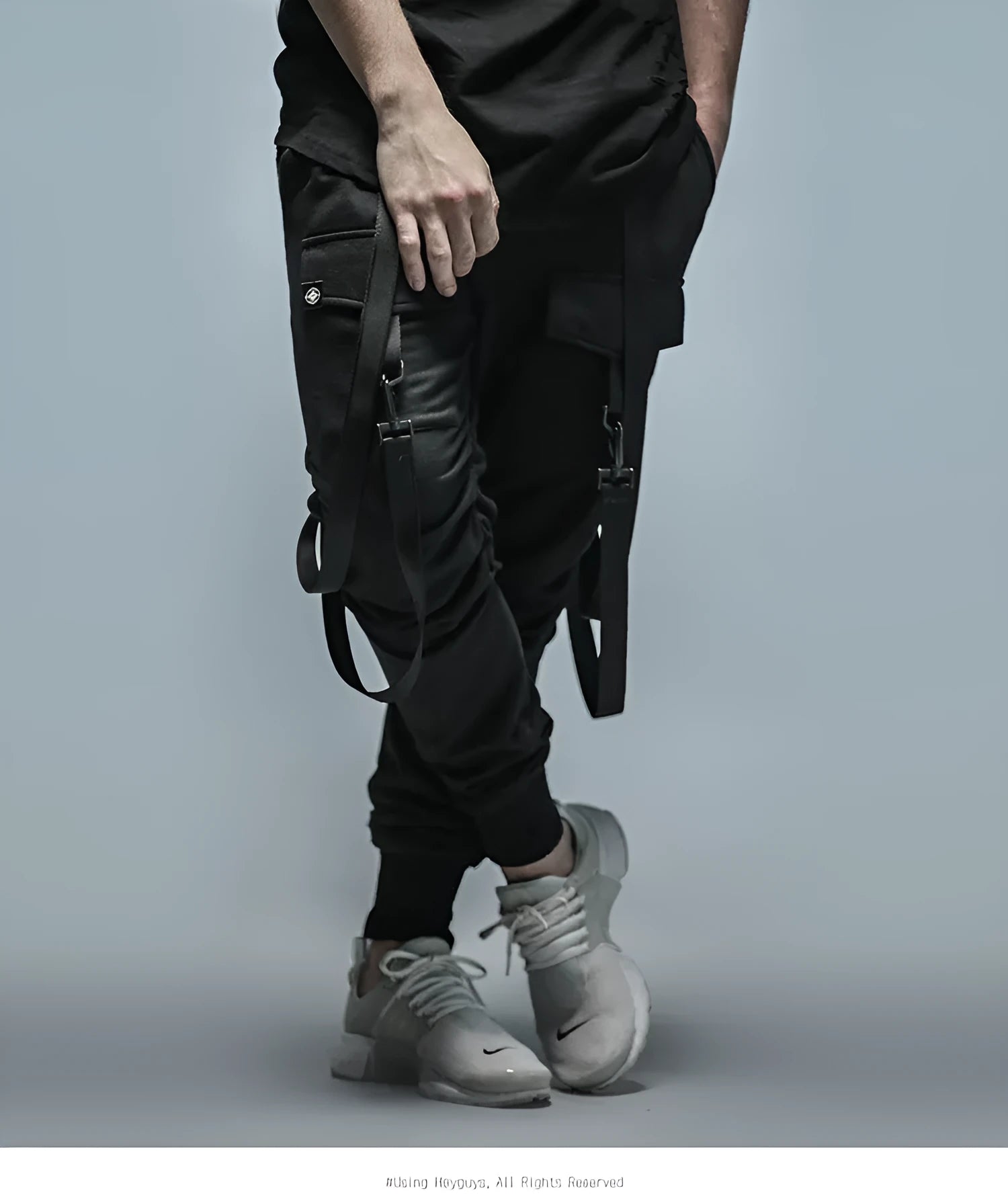 Black cotton blend men's hip hop pencil sweatpants with belt lying flat