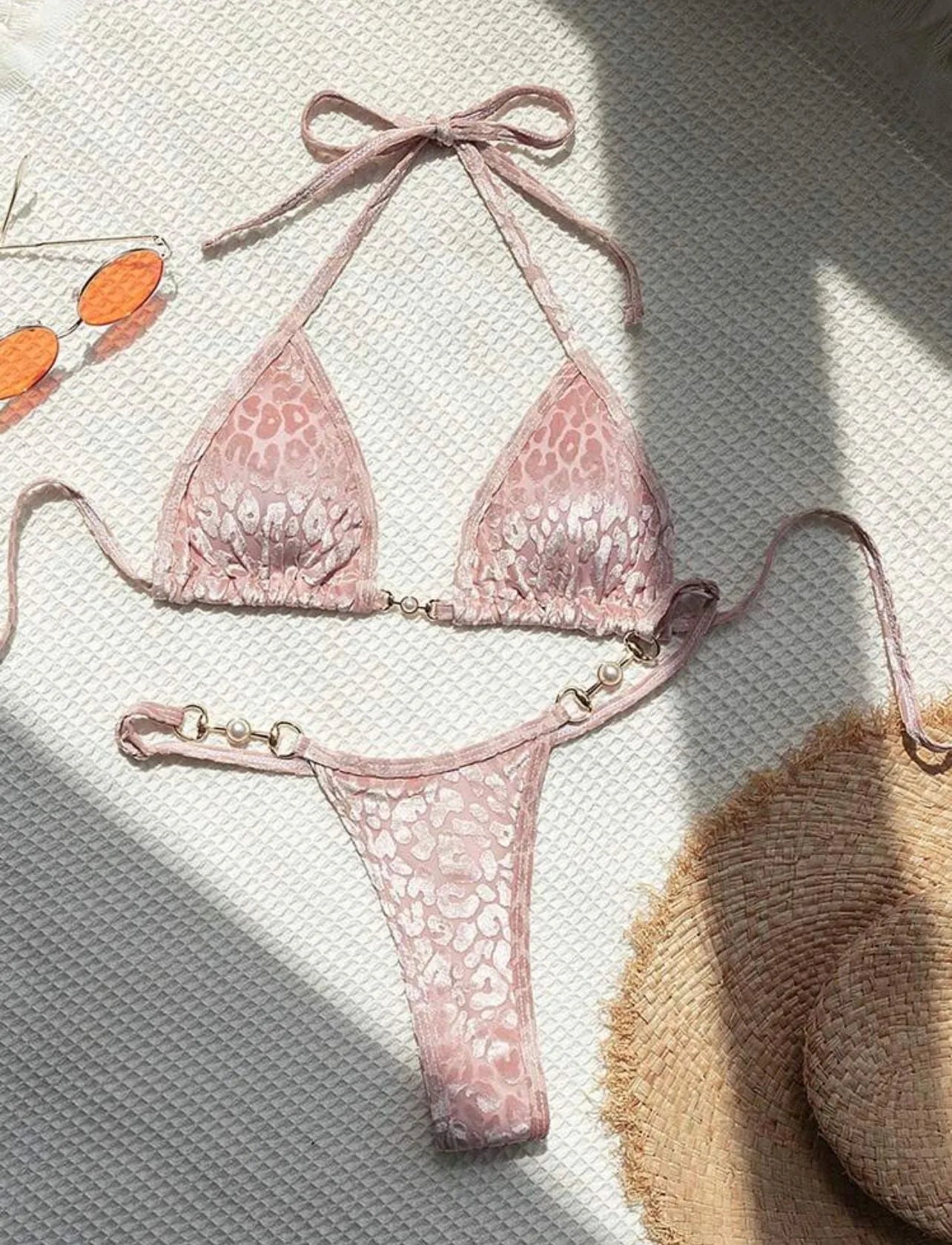 Women's blue leopard print T-shaped bikini swimsuit made from polyester and spandex fabric.