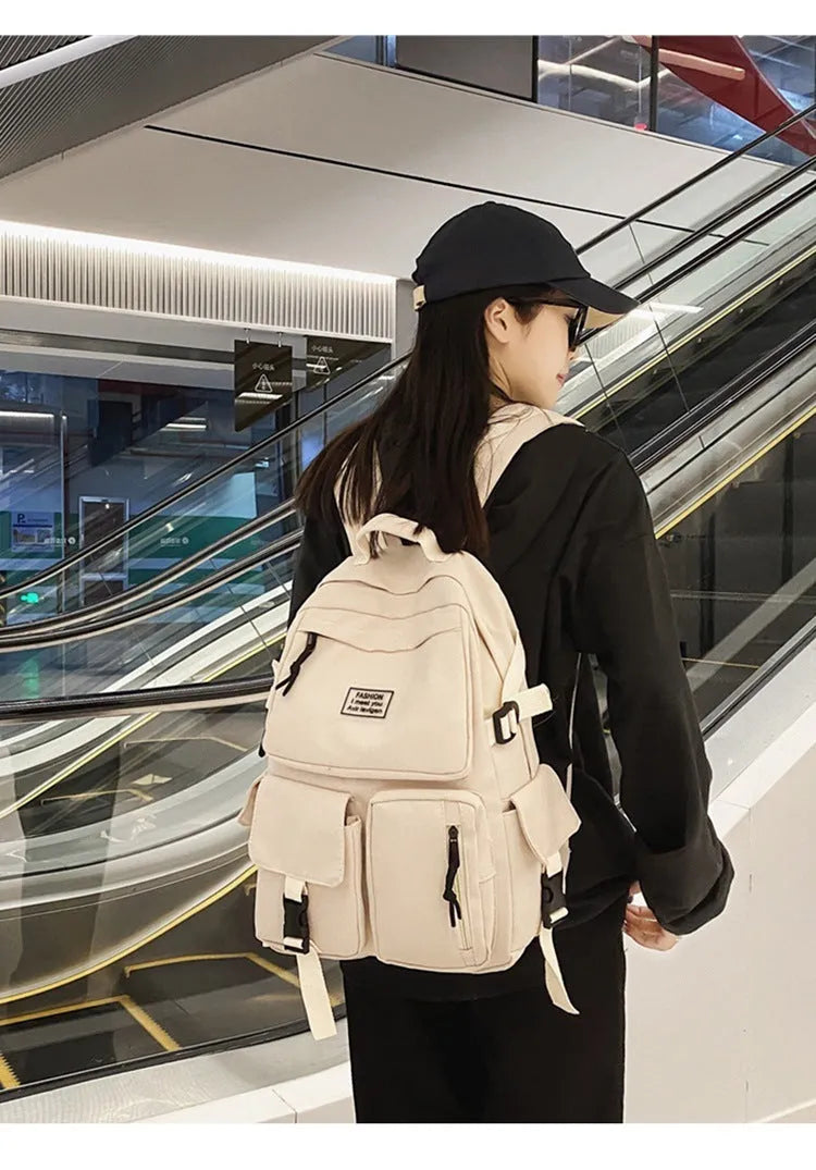 Black nylon student backpack showing laptop compartment and three-dimensional pockets