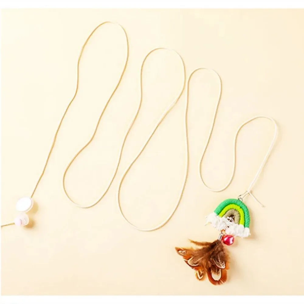 Cat door swing toy with colourful feathers on elastic cord attached by sticky buckle clamp