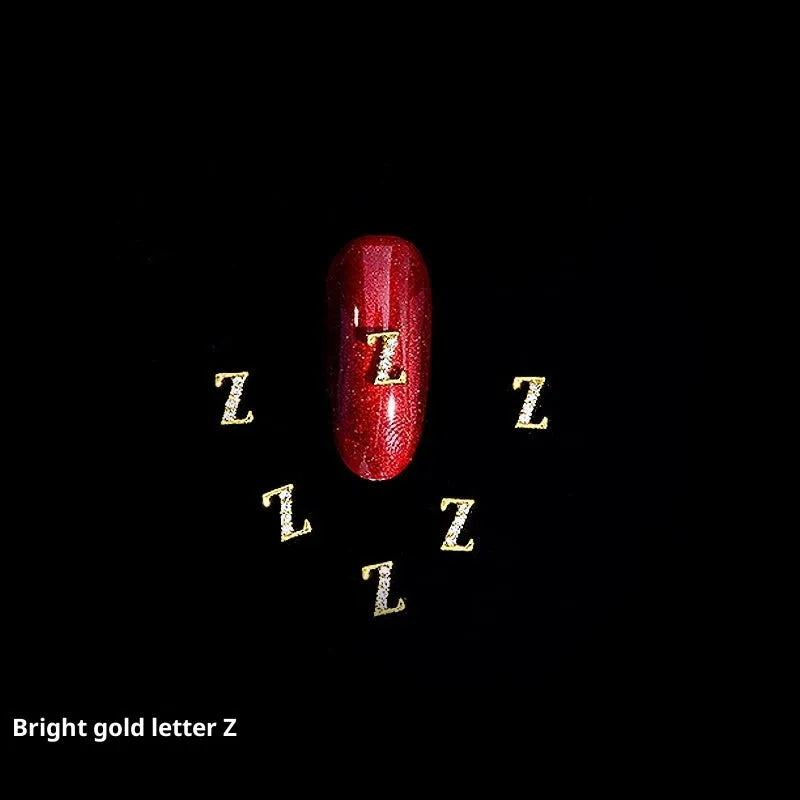 Gold alloy letter A nail ornament charm with crystal detail on a square chain base