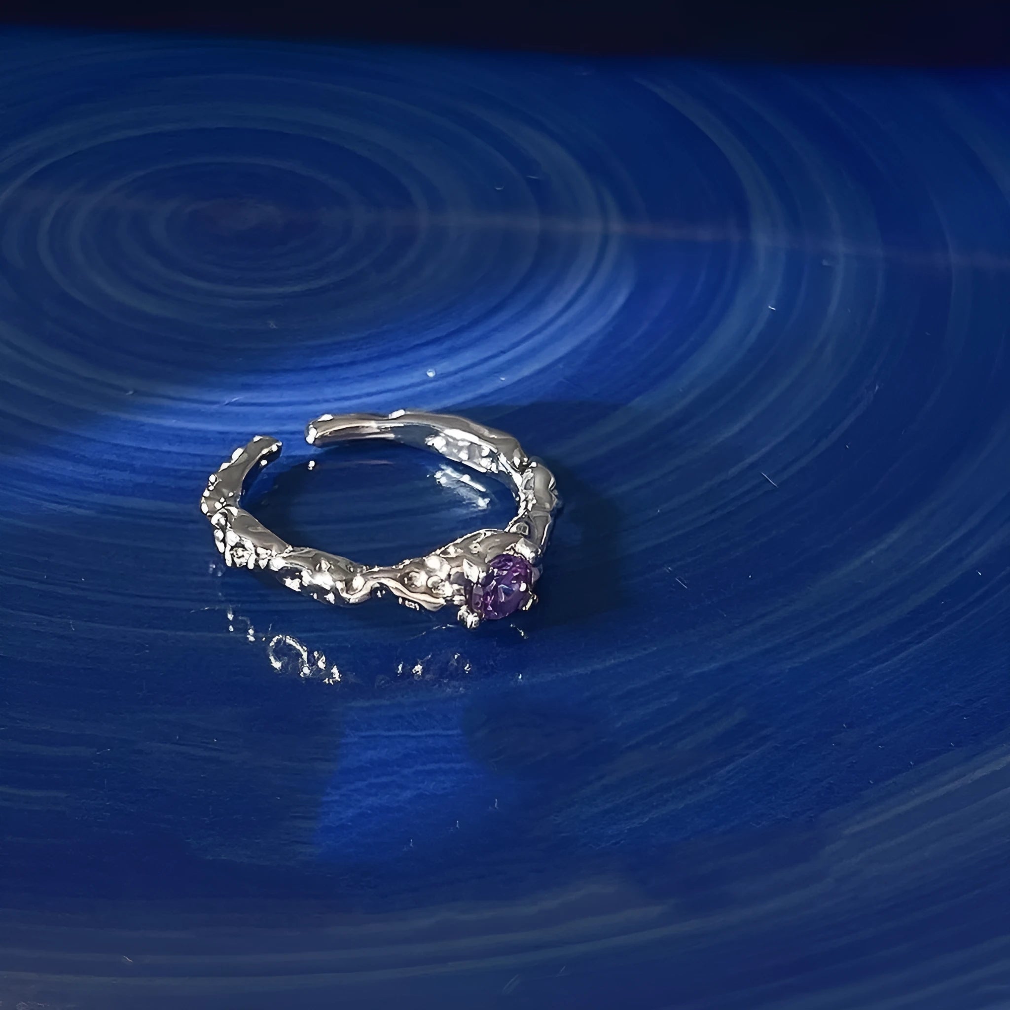Open mouth ring in lava purple diamond colour, zinc alloy construction, geometric shape with dot detail, adjustable fit.