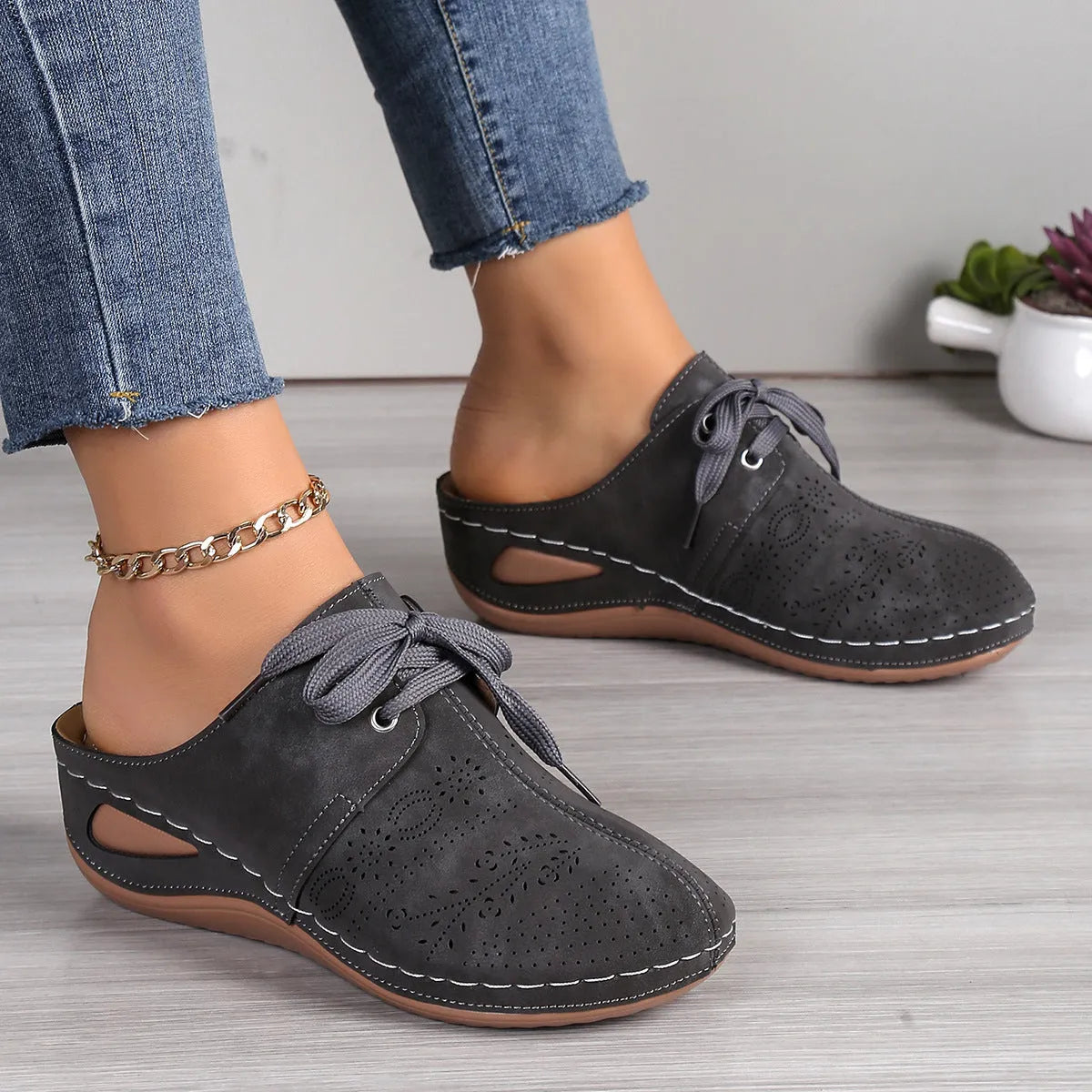 Women's lace-up Baotou slippers with hollow-out wedge design in suede material, available in multiple colours.