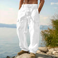 Men's loose cotton wide-leg casual trousers in light army green colour on a hanger.