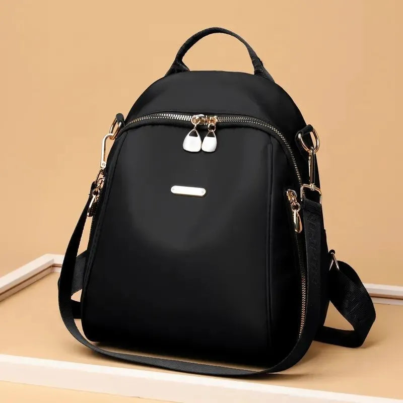 Women's Oxford cloth casual travel backpack in urban simplicity style with sewing line detail and sandwich pocket