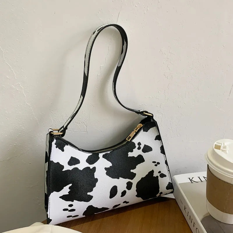 Small square PU leather underarm bag in a selection of colours and patterns including leopard print