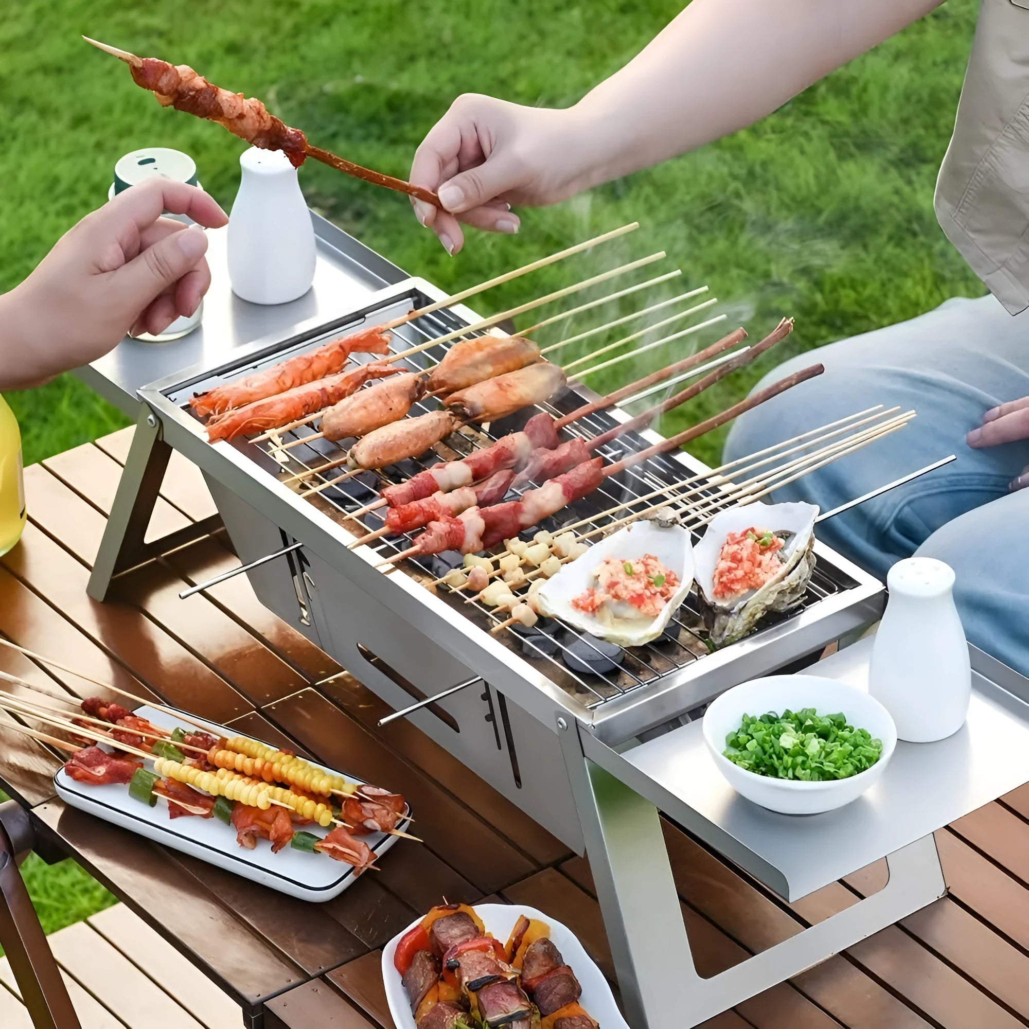 Small foldable portable charcoal grill for camping and outdoor cooking