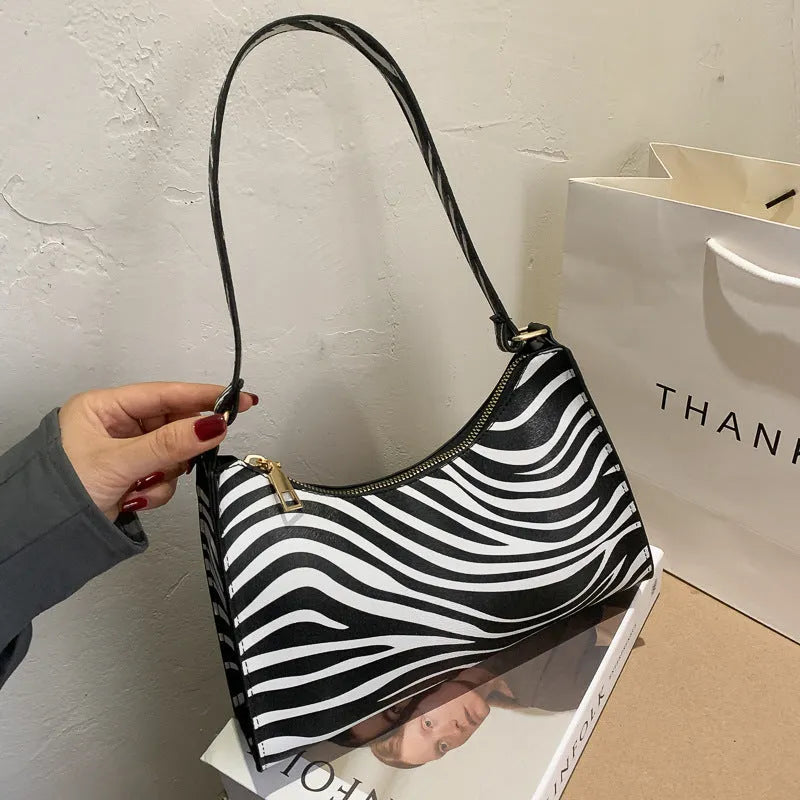 Small square PU leather underarm bag in a selection of colours and patterns including leopard print