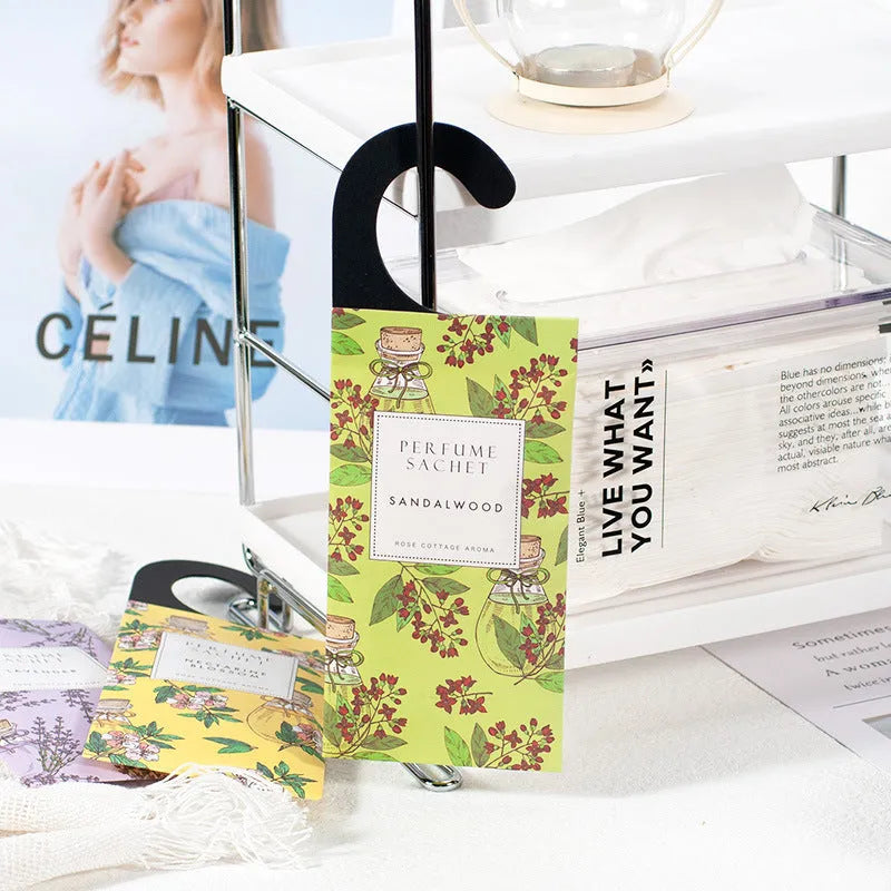 Five 30g lavender and rose scented wardrobe sachets on a shelf, each measuring 21x8cm