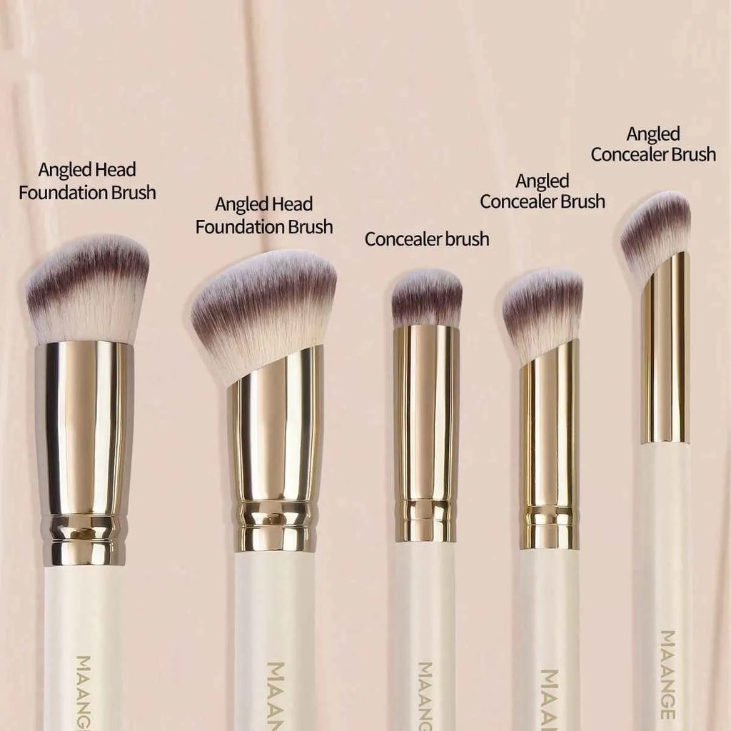 MAANGE five apricot coloured makeup brushes with angled blush brush on pink surface