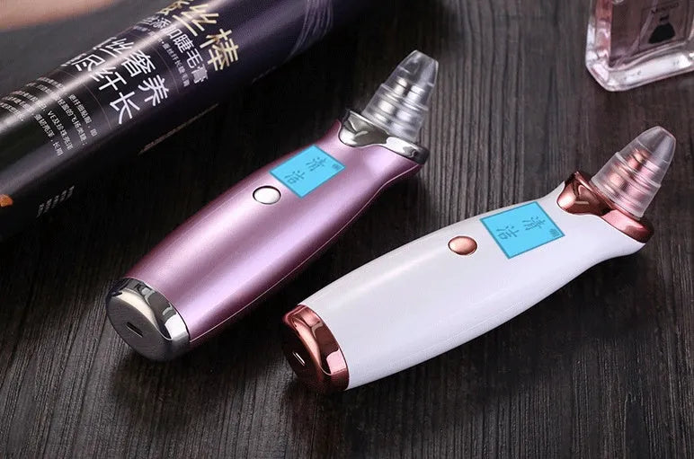 Blackhead remover pore cleaner with LCD display in ivory white on a clean surface