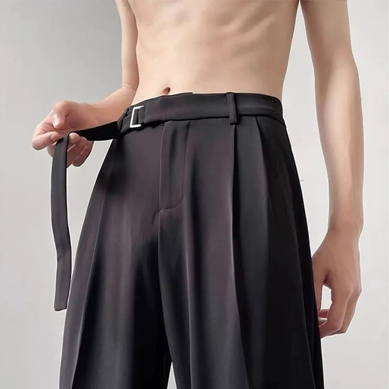 Black loose fit wide leg casual trousers with straight hem on a mannequin.