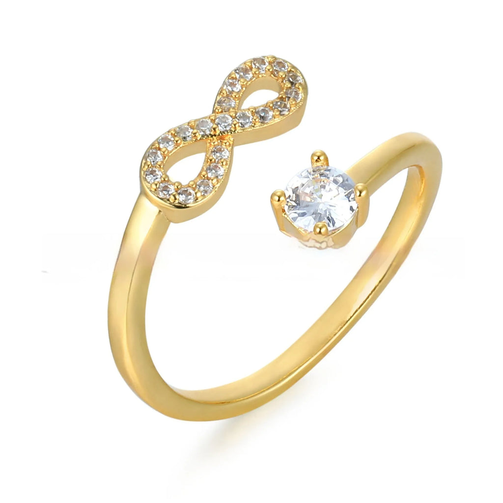 Open geometric ring with zircon stones featuring an English letter, available in gold, rose gold, and silver finishes.