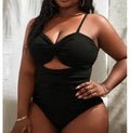 Plus size women's one-piece solid black swimsuit made from breathable polyester with spandex lining