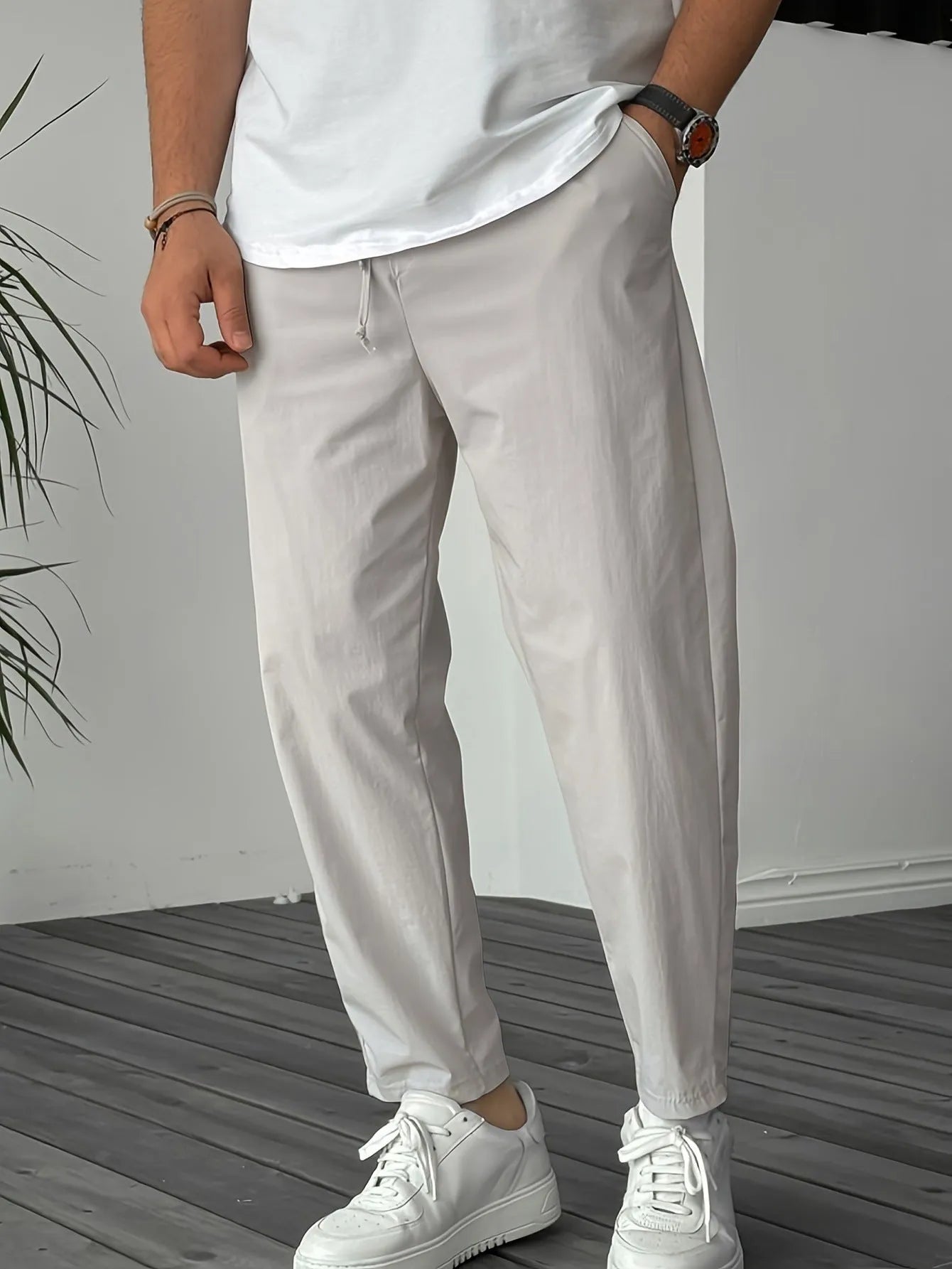 Men's khaki straight-leg casual trousers with a drawstring waist and ribbon pocket.