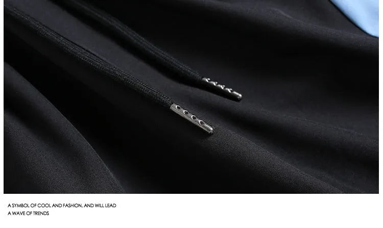 Black and grey loose-fit quick-drying sports shorts with elastic waistband above knee length