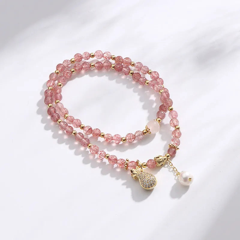 Women's geometric strawberry quartz crystal bracelet with adjustable fitting for money drawing