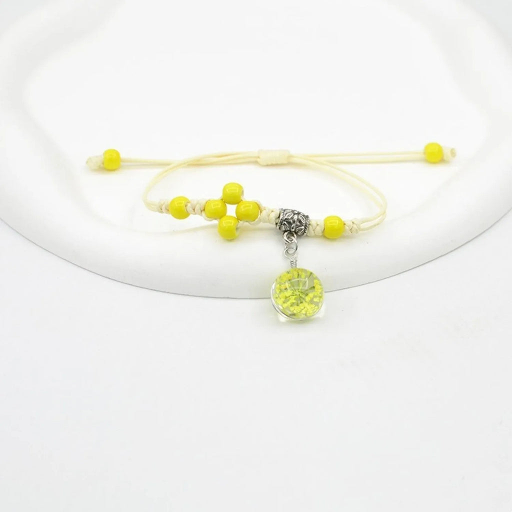 Hand-woven glass bracelet with 1.4cm beads containing real dried flowers in various colours