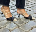 Women's apricot and black colour block stiletto heel sandals with a buckle fastening and pointed toe.