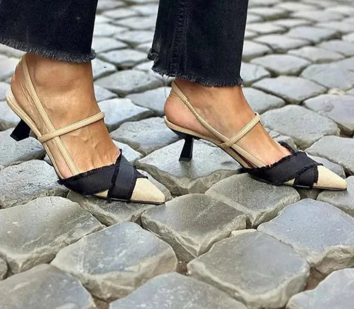 Women's apricot and black colour block stiletto heel sandals with a buckle fastening and pointed toe.