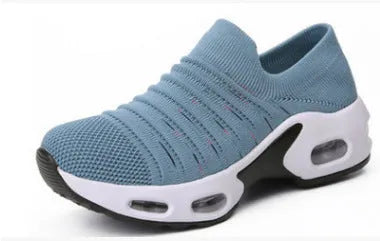 Women's fly-knit stretch sock shoes in light grey with low heel and round toe.