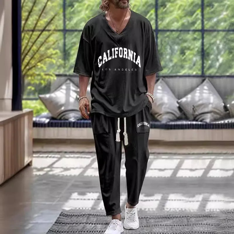 Man's thin polyester tracksuit set with V-neck cropped sleeve jacket and matching trousers