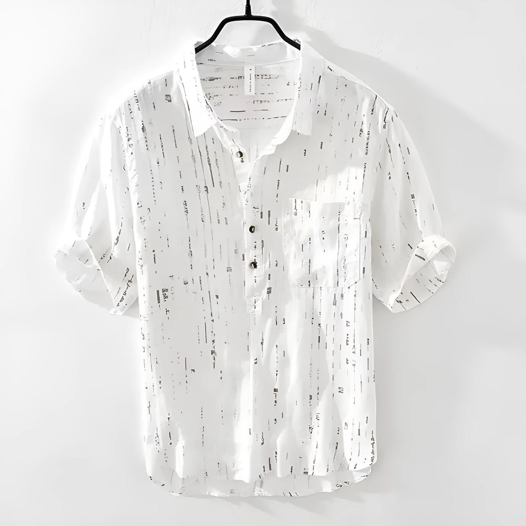 A man's loose-fit short-sleeved polo shirt in black, showing the lapel collar and casual cardigan style.