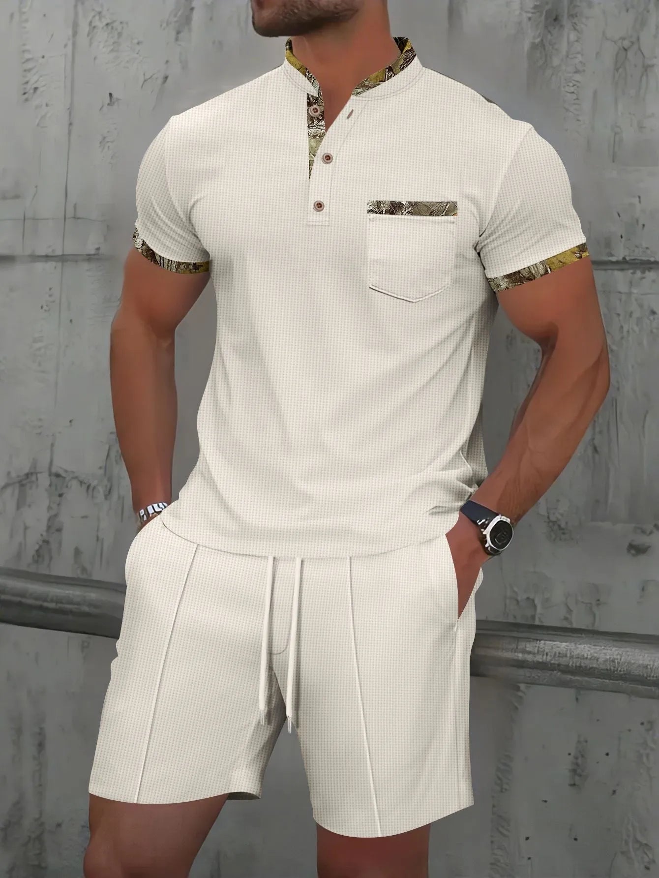 Men's grey waffle polo collar short sleeve suit top and shorts laid flat.