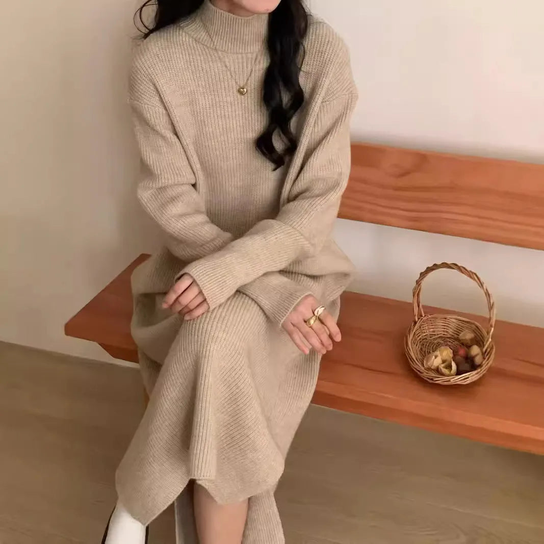 Women's knitted half turtleneck dress in acrylic with long sleeves and a high-waisted midi skirt.