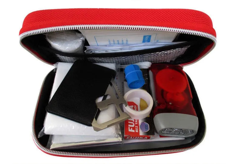 Red plastic survival medical kit emergency storage box with 18 first aid pieces including scissors and bandages