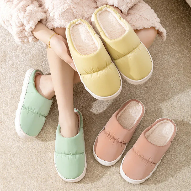 Down cotton winter slippers with artificial leather upper, thick rubber sole, and plush lining in blue colour