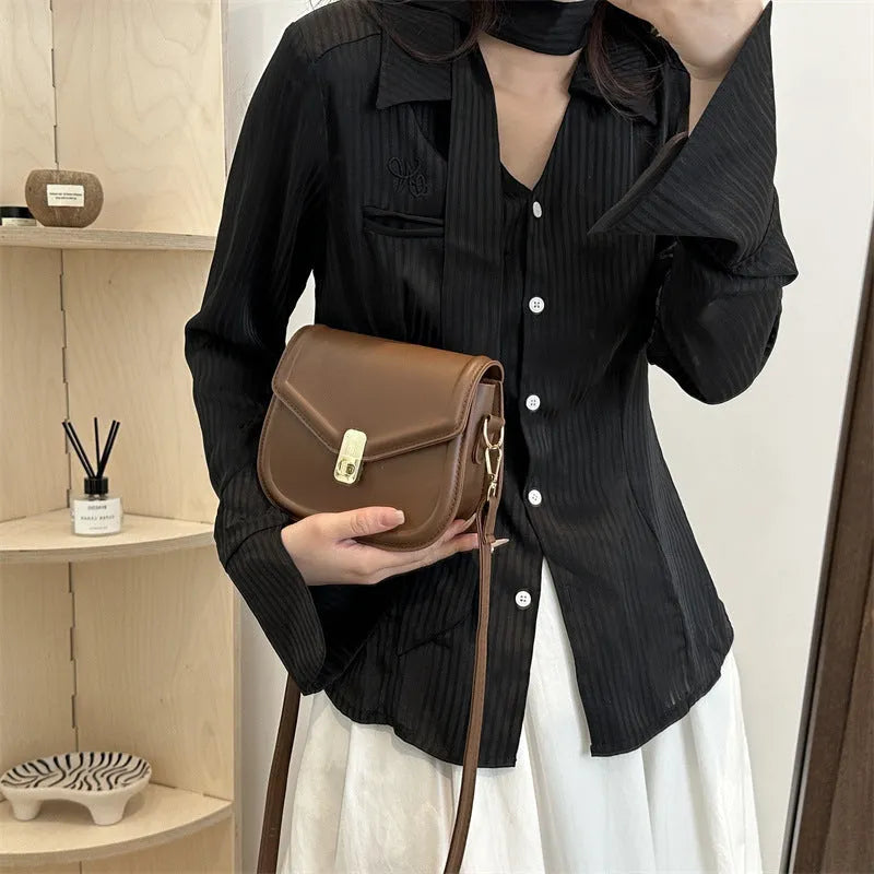 Unisex PU leather clamshell shoulder messenger bag in horizontal square design with adjustable strap