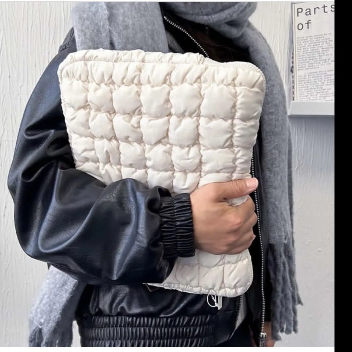 Black nylon laptop bag with cloud cotton interior padding shown next to a white version, sized for a 15.6-inch laptop.