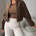 Women's off-shoulder short coat with lantern sleeves in milky white colour showing loose casual fit
