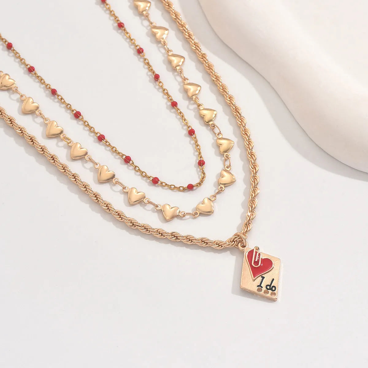 Women's three-layer geometric love necklace with heart pendant on adjustable clavicle chain