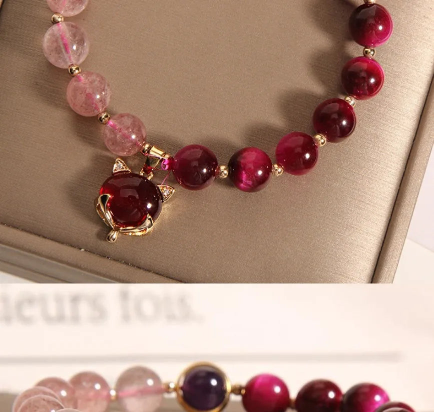 Women's strawberry crystal bracelet on elastic rope measuring 18cm with simple jewellery design