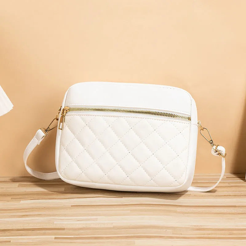 PU leather crossbody bag in horizontal square shape with large-capacity, diamond mesh and stitching details, available in white, black, pink