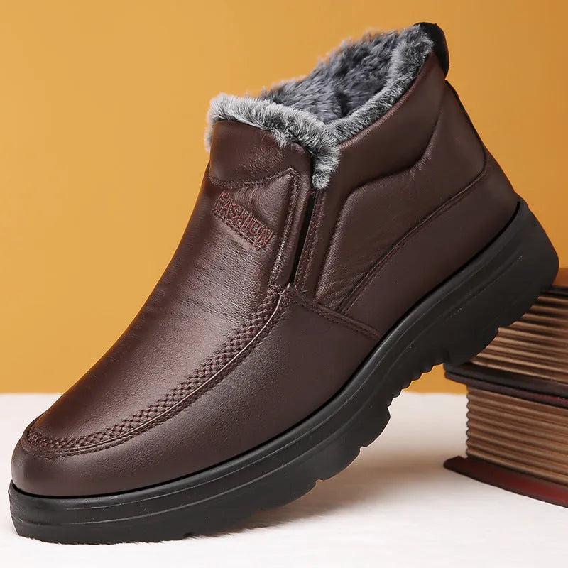 Men's black winter slip-on shoes with fleece lining and rubber sole on grey background