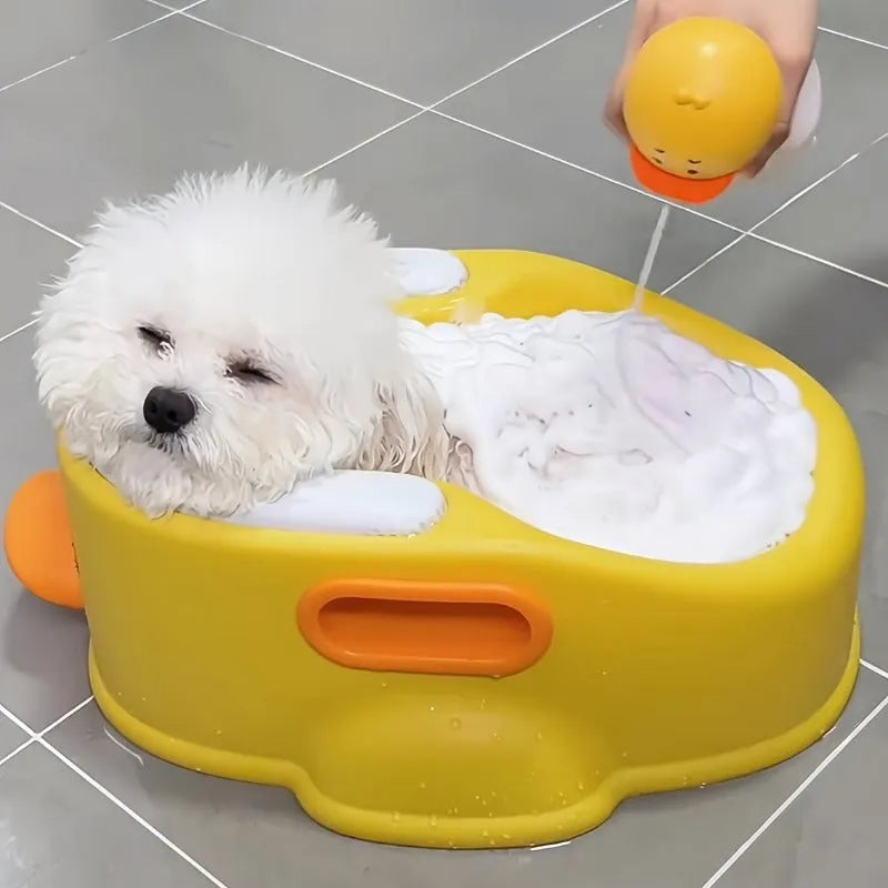 Blue PVC duck-shaped pet bath tub for washing dogs and cats on a bathroom floor.