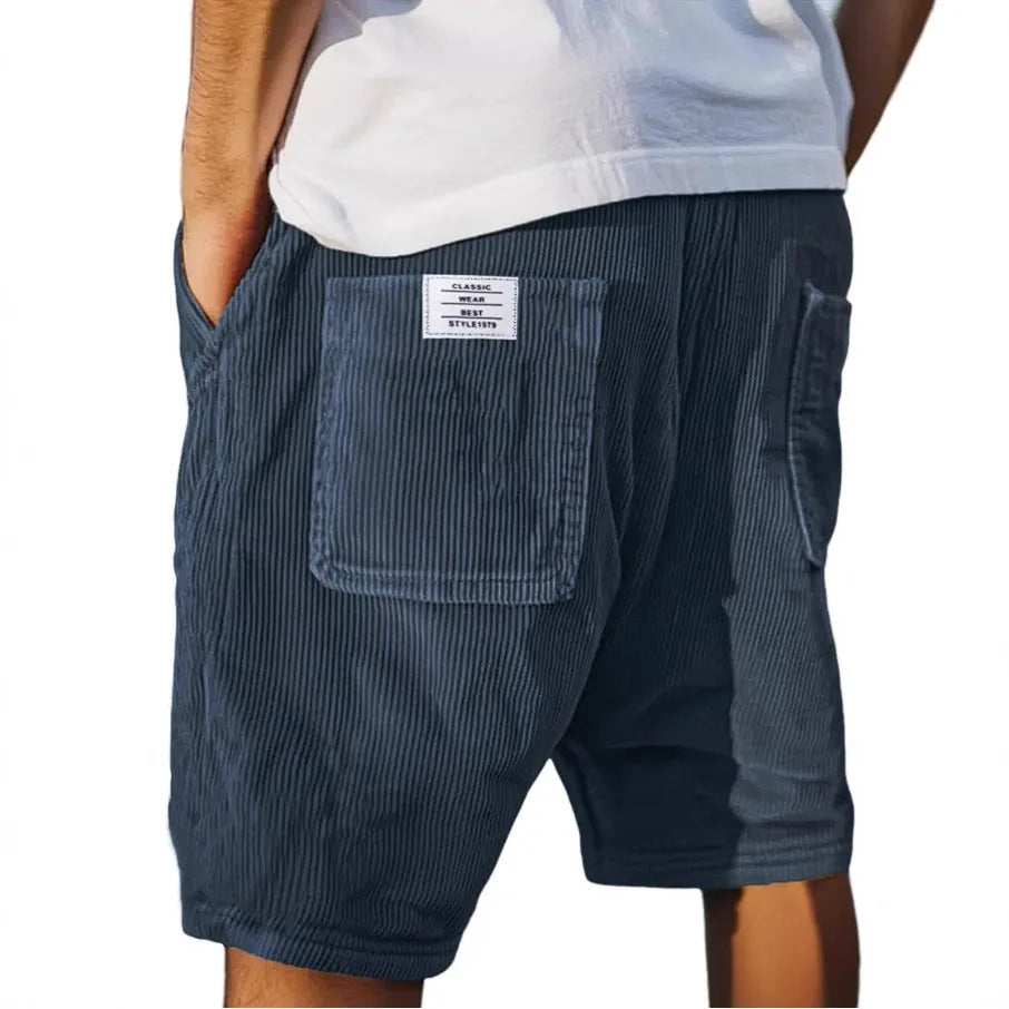 Men's grey straight-leg corduroy shorts with multiple pockets and embroidery detail on a hanger.