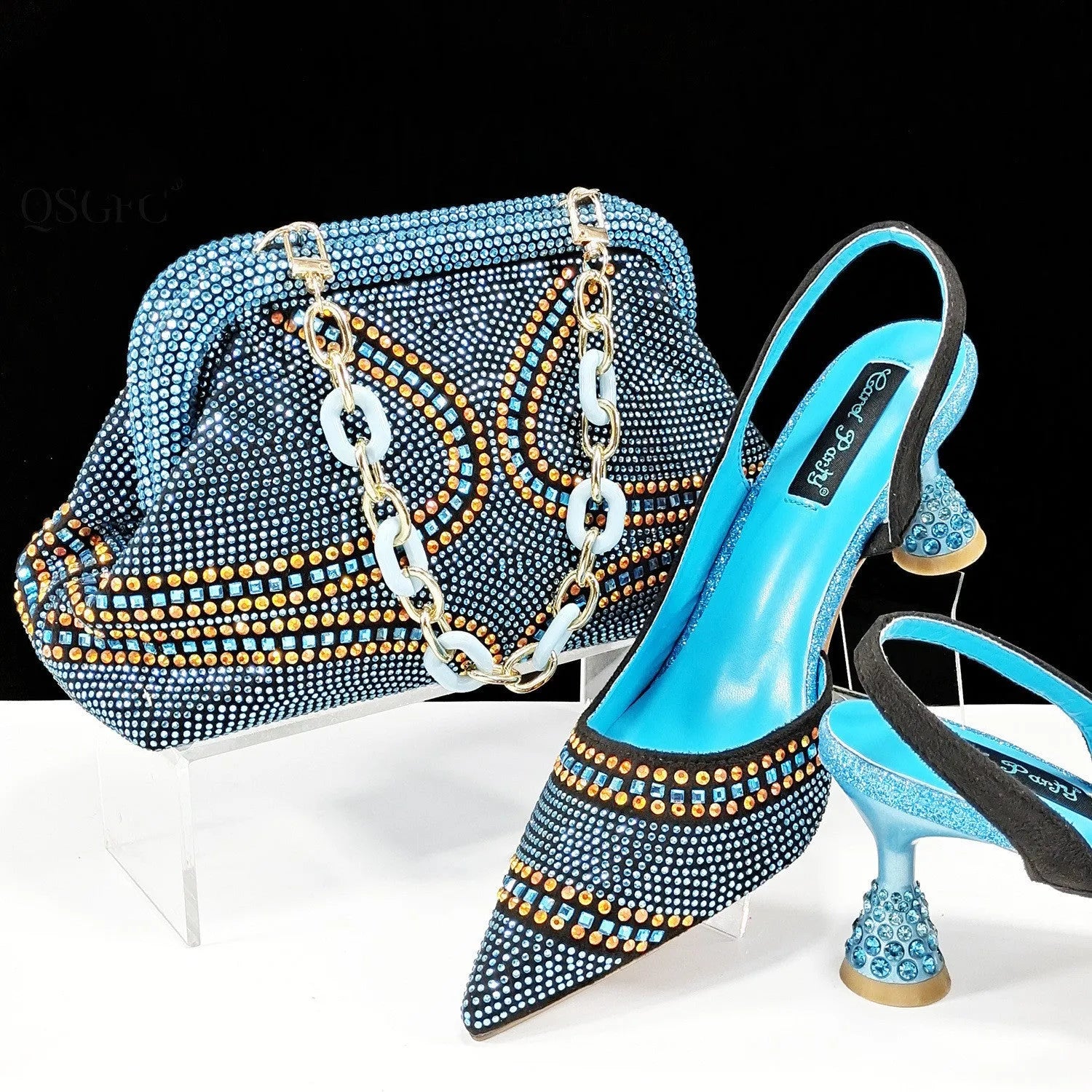 Women's pointed toe high heels with rhinestones and a matching small bag, shown in one of eight available colours.