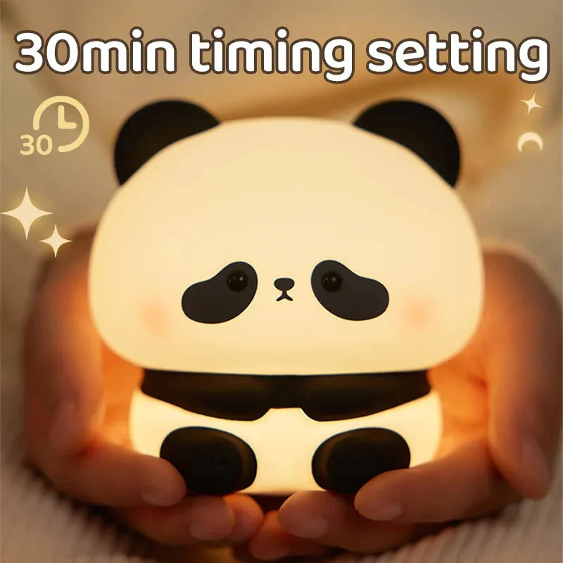 Panda LED night light with soft silicone head, USB rechargeable, touch control, colourful lights, on a bedside table